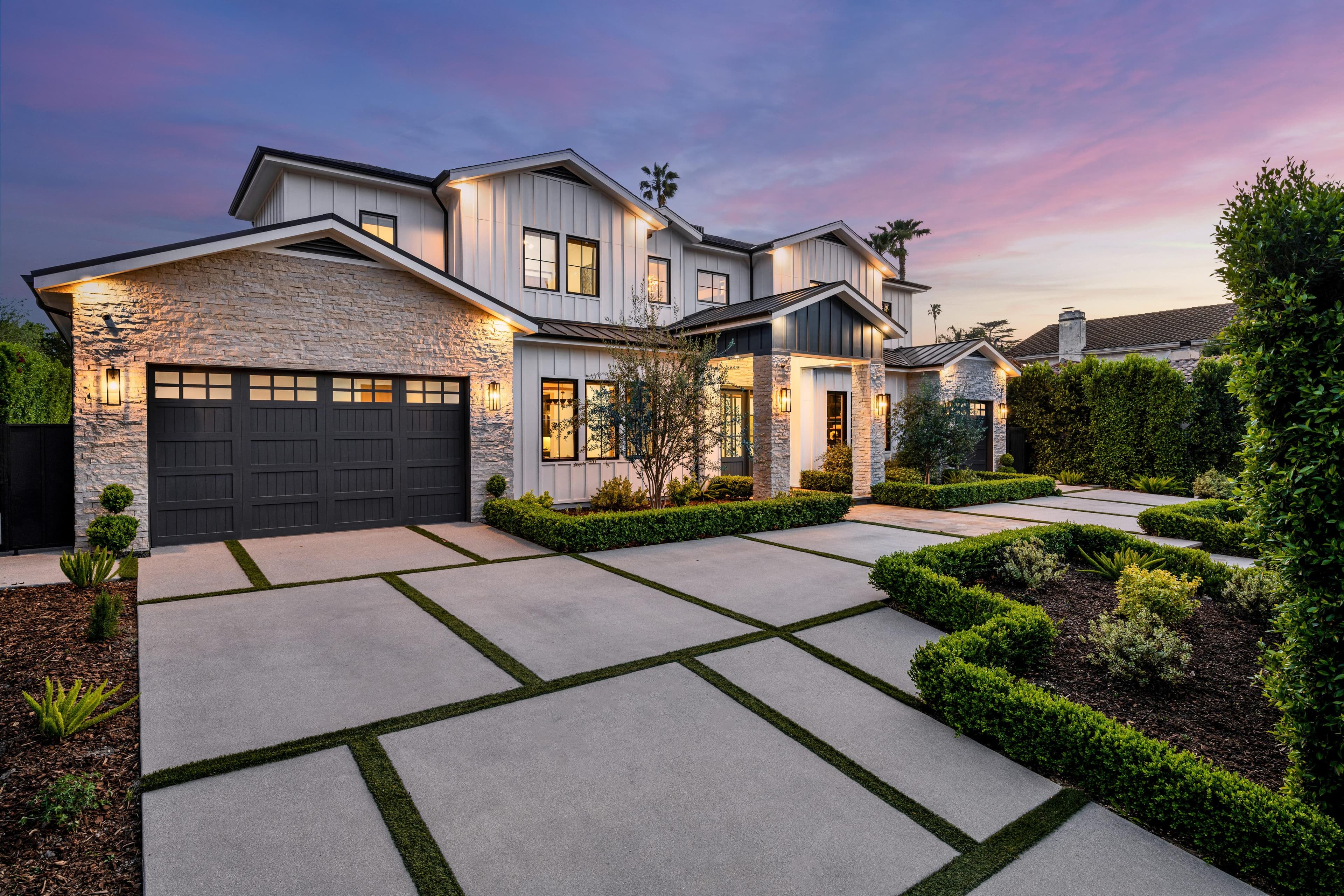 A landscaped path between two garden beds leading to a home — the step-by-step journey from first call to ownership