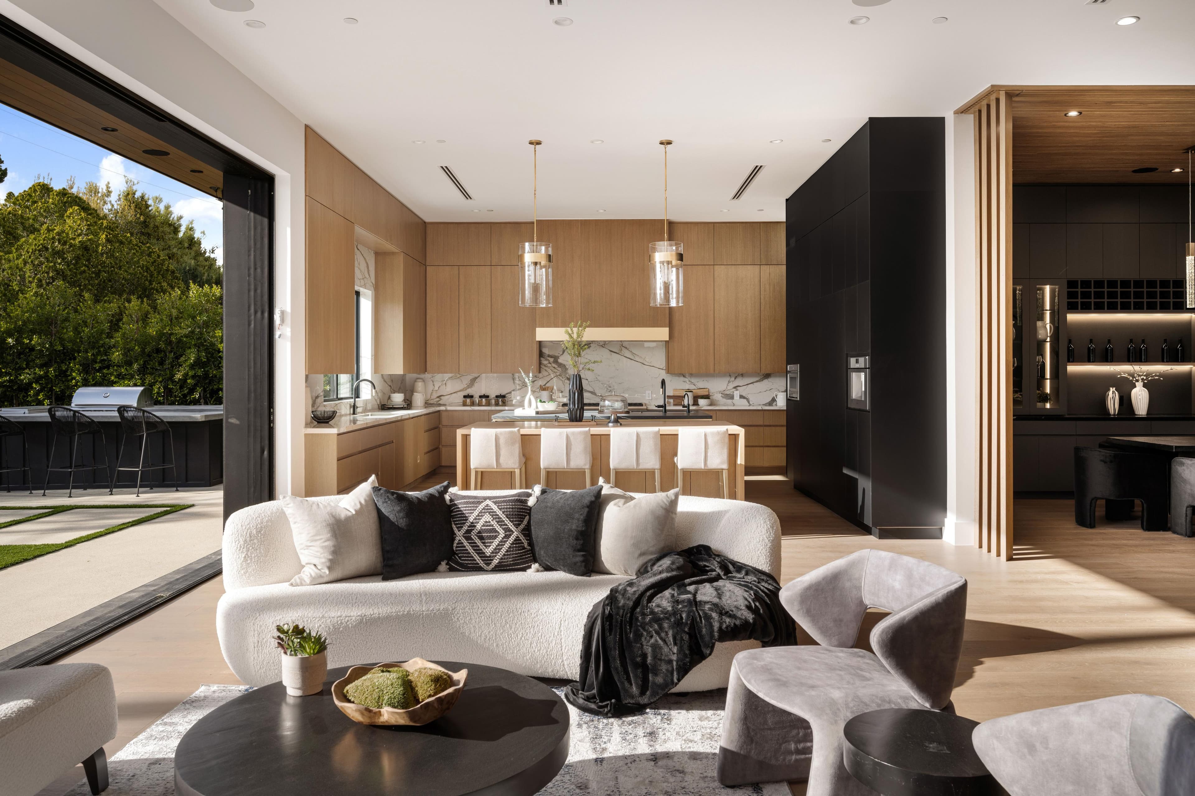 Bright, open-concept living room and kitchen — rental-ready interior of a curated property